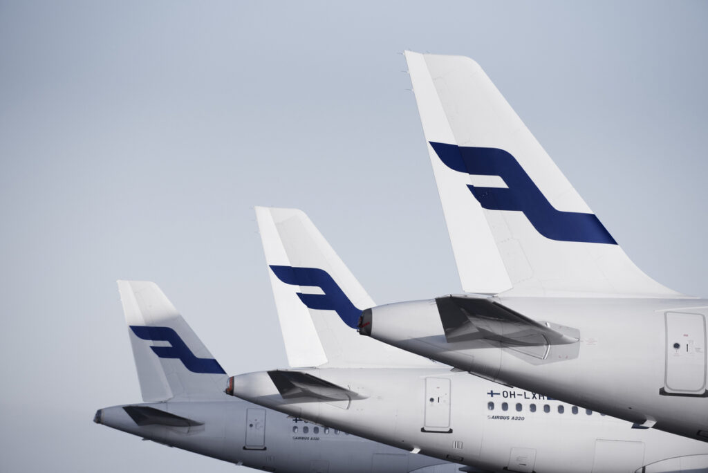 A line of parked Finnair aircraft