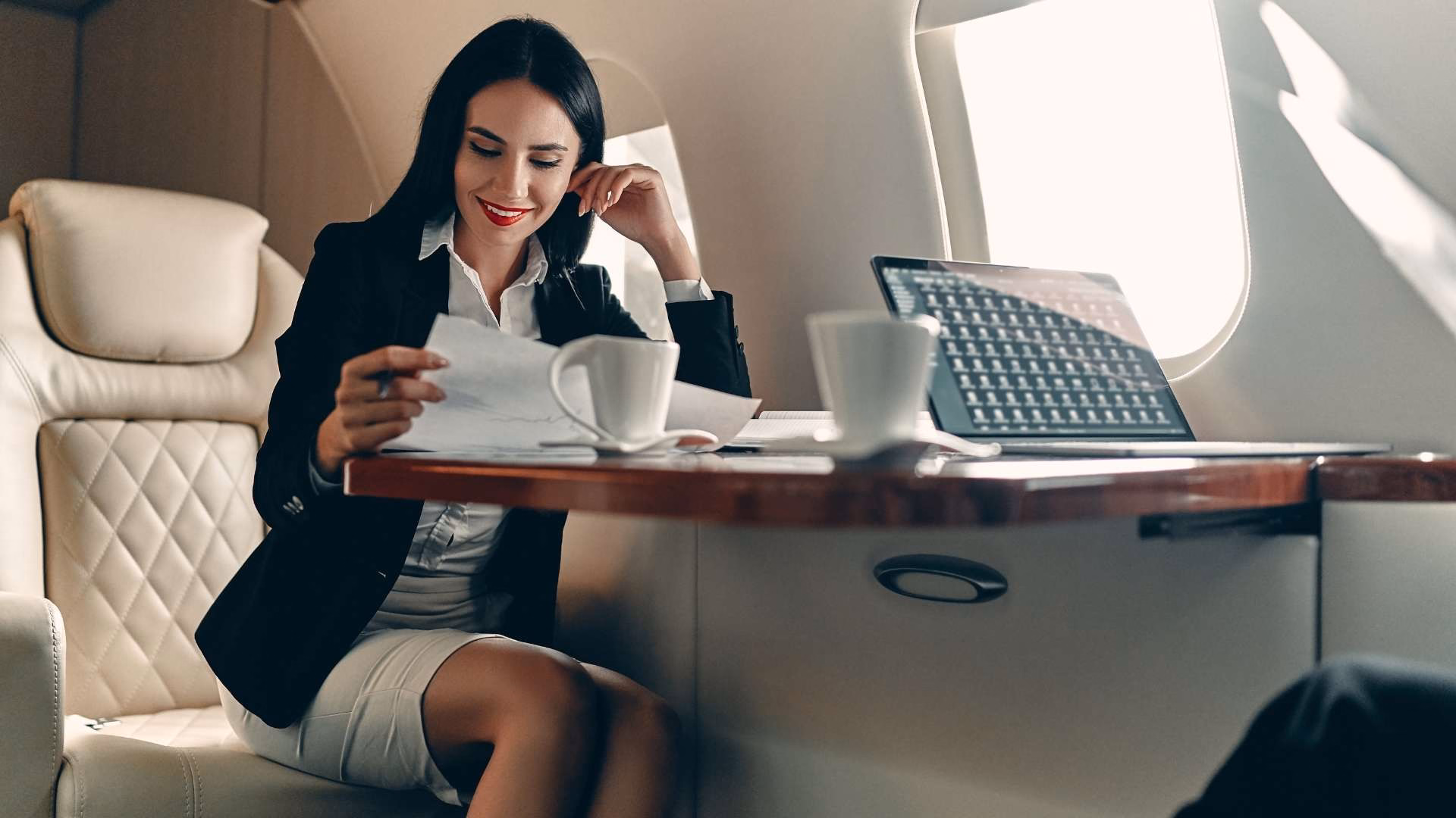 A businesswoman using private jet charter services